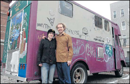 TRAVELING CANVAS: On the side of his bread truck, Hess wrote the address of his website telling the story of the truck's transformation. Taggers have added flourishes to the rolling work in progress.